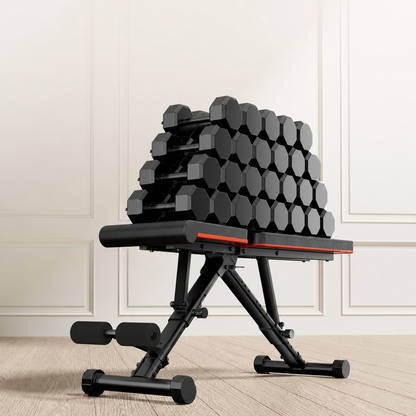 Adjustable folding weight bench loaded with a stack of weight plates